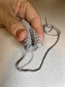 a person holding a yarn