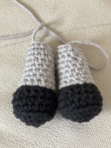 a pair of crocheted objects